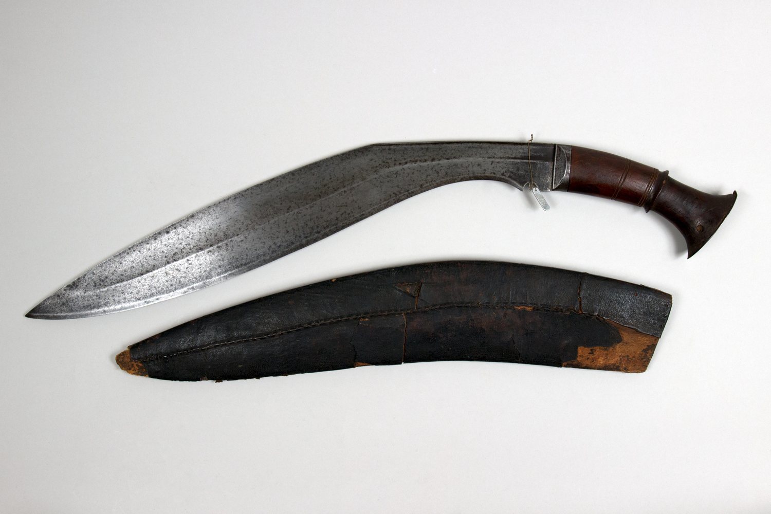 An eighteenth-century khukuri and its leather scabbard